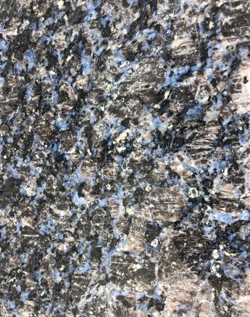 Teja Blue granite slab polished with blue grey base and fine grain pattern